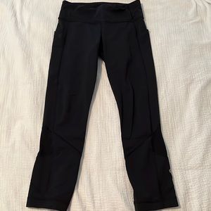 Black crop Lululemon leggings with mesh detail